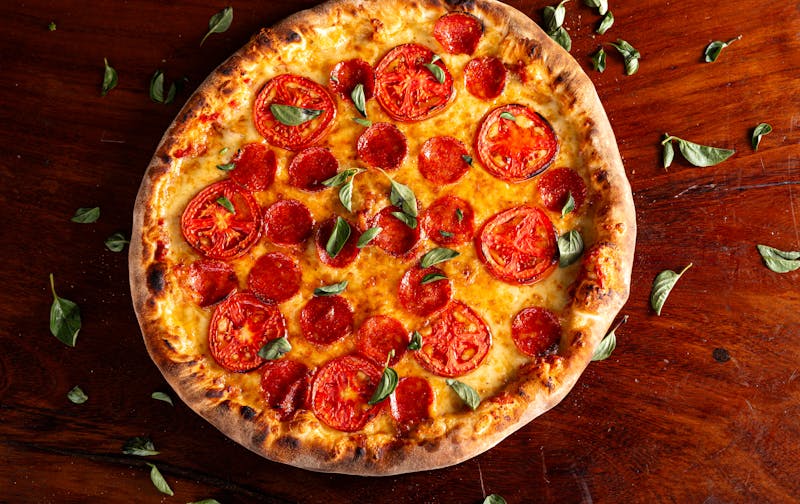 Pepperoni thin crust pizza with crispy edges
