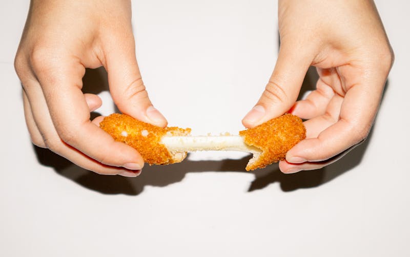 Mozzarella sticks with marinara sauce appetizer